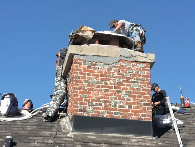 East Hampton Chimney Sweep installing a custom chimney crown in East Hampton, CT