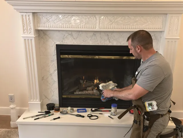 East Hampton Chimney Sweep performing fireplace maintenance in East Hampton, CT