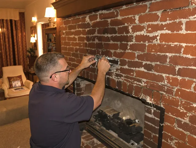 East Hampton Chimney Sweep expert fixing a fireplace in East Hampton, CT